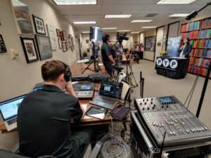 audiovisual technicians film and broadcast a livestreaming event