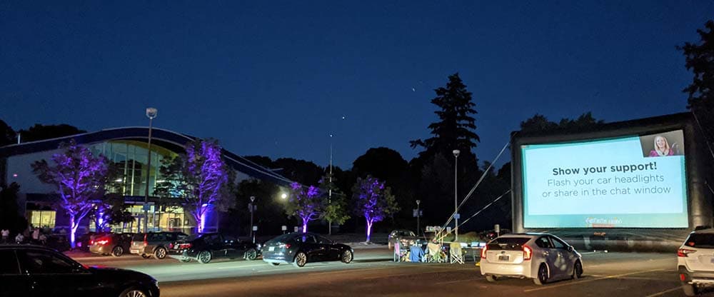 guests in their cars attend a virtual drive-in gala fundraiser