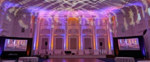 The Governor Ballroom in the Sentinel Hotel in Portland Oregon is set for an event with uplighting, large screens, projection