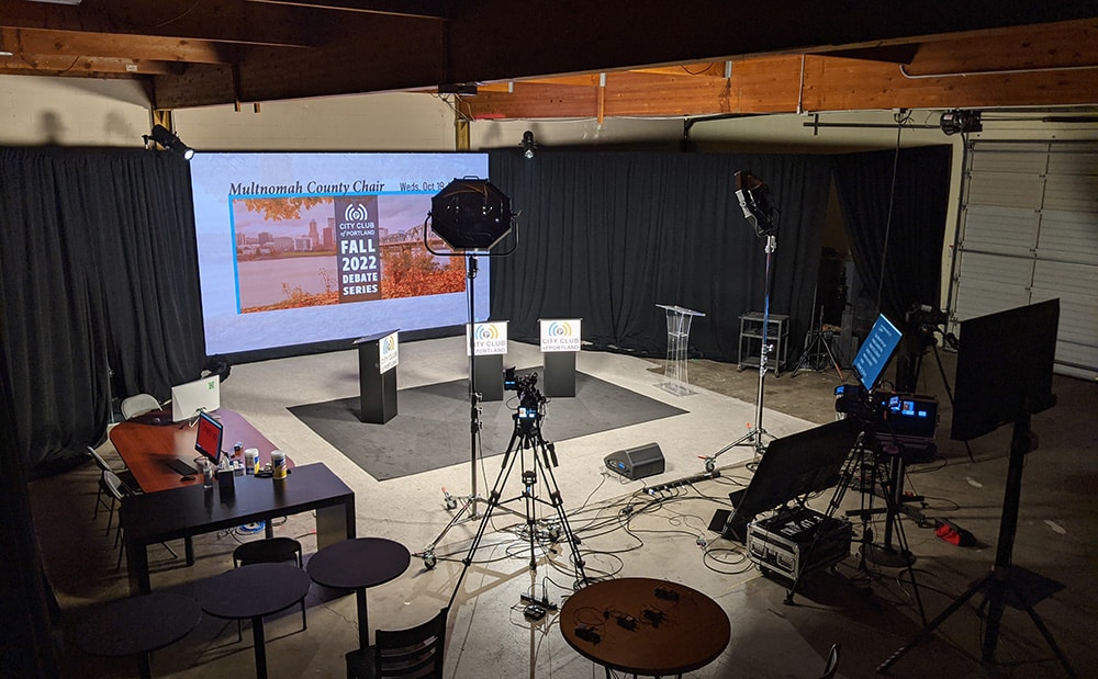 The set of a live streamed debate included three podiums
