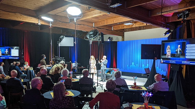 Behind the scenes in the studio as a virtual event live streams in front of a studio audience