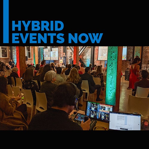 Hybrid Events Now - a technician controls robotic cameras remotely
